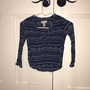 Blue button up shirt with floral design